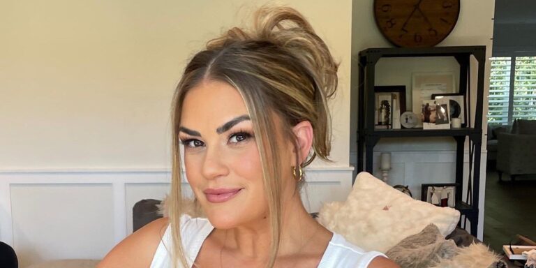 Brittany Cartwright Vanderpump Rules in white tank top smiling